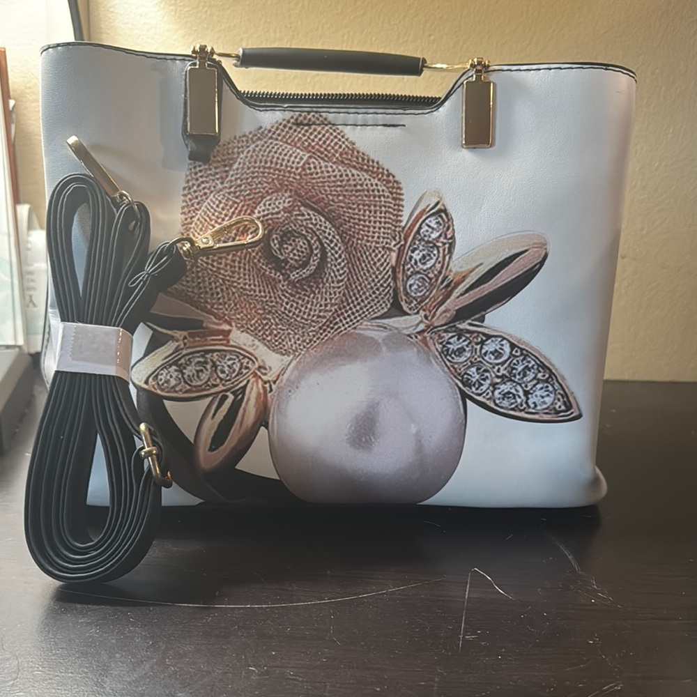 Chic White and Black Shoulder Bag with Floral Appliqué